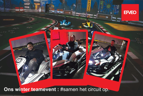The EFVEO team during the winter team event: colleagues together in the karting hall, with karts and track in the background.